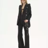 High-rise flared pants in wool grain de poudre