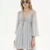 Pleated mini dress in silk mousseline