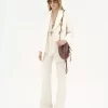 High-rise flared pants in wool grain de poudre