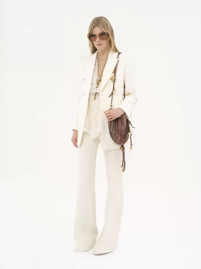 High-rise flared pants in wool grain de poudre
