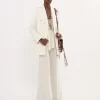 High-rise flared pants in wool grain de poudre